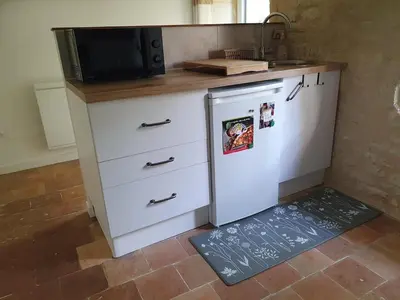 Cuisine ou kitchenette dans l'établissement Studio cosy & ses troglos 
