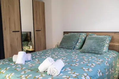 Un ou plusieurs lits dans un hébergement de l'établissement Casa Rochelaise - By Primo Conciergerie