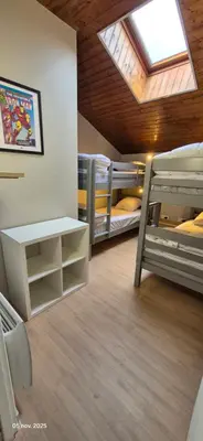 Un ou plusieurs lits dans un hébergement de l'établissement Gites Le Saint Martin Le Convivial 6-8 people