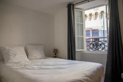 Un ou plusieurs lits dans un hébergement de l'établissement Le cocon - Plein de charme dans l'hyper centre