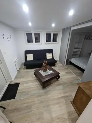 Coin salon dans l'établissement Apartment