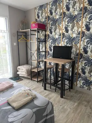 Un ou plusieurs lits dans un hébergement de l'établissement Petit studio attenant à la maison