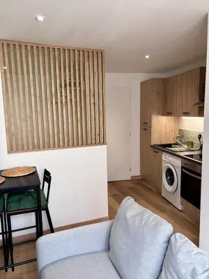 Cuisine ou kitchenette dans l'établissement Le Cocon Vert