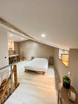 Un ou plusieurs lits dans un hébergement de l'établissement Le cosy duplex de l'Isle d'Espagnac