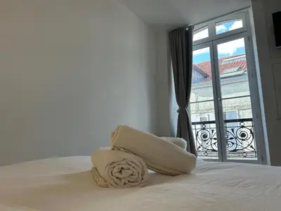 Un ou plusieurs lits dans un hébergement de l'établissement La Maison Béraud - Prestige - Centre historique de La Rochelle