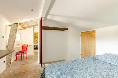 Un ou plusieurs lits dans un hébergement de l'établissement L'Atelier du Clos avec Jacuzzi