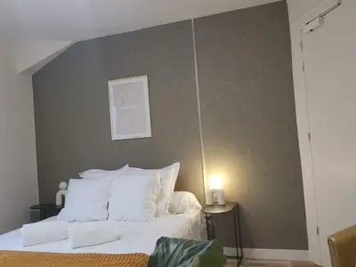 Un ou plusieurs lits dans un hébergement de l'établissement Hôtel et Restaurant Les2M