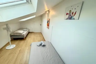 Un ou plusieurs lits dans un hébergement de l'établissement Bright triplex in the heart of La Rochelle