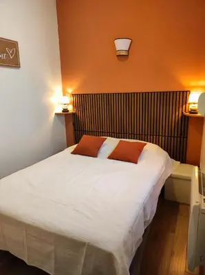 Un ou plusieurs lits dans un hébergement de l'établissement appartement Zéphyr