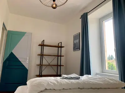 Un ou plusieurs lits dans un hébergement de l'établissement Spa Wifi Canal Plus