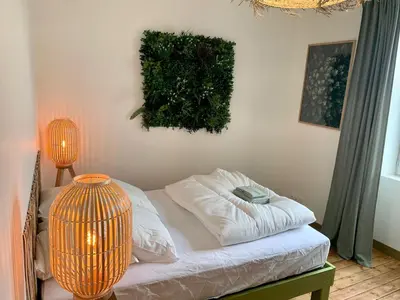 Un ou plusieurs lits dans un hébergement de l'établissement Spa Wifi Canal Plus