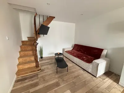 Coin salon dans l'établissement Maison avec courette