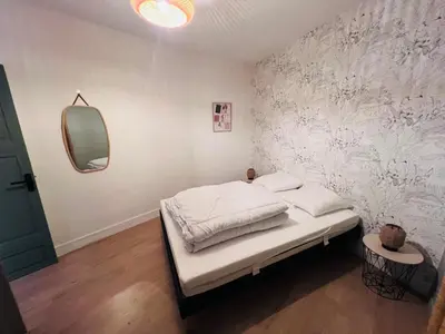 Un ou plusieurs lits dans un hébergement de l'établissement Appartement cosy 2 pieces hyper centre ville Place de la Breche