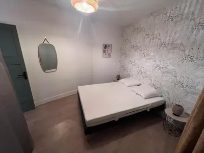 Un ou plusieurs lits dans un hébergement de l'établissement Appartement cosy 2 pieces hyper centre ville Place de la Breche
