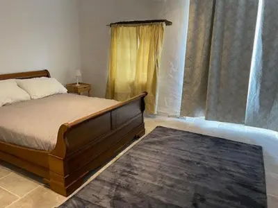 Un ou plusieurs lits dans un hébergement de l'établissement La Maison du Petit Jacques - Rose Cottage