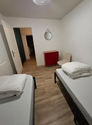 Un ou plusieurs lits dans un hébergement de l'établissement Gîte à la ferme ''Chez Jean''
