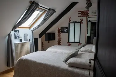 Un ou plusieurs lits dans un hébergement de l'établissement Les chambres du Bocage - Chambre Marylin