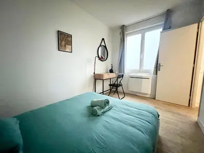 Un ou plusieurs lits dans un hébergement de l'établissement Appartement calme Proche du Centre - 2 chambres - Wifi gratuit