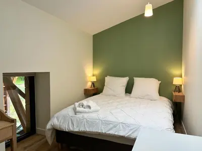 Un ou plusieurs lits dans un hébergement de l'établissement Villa Lucienne, maison de charme à la campagne