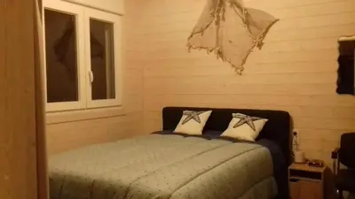 Un ou plusieurs lits dans un hébergement de l'établissement Charmante maison près de Sainte-Gemme avec jardin