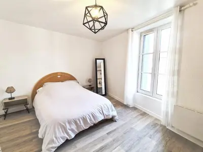 Un ou plusieurs lits dans un hébergement de l'établissement La Chaume, jolie appartement à Poitiers