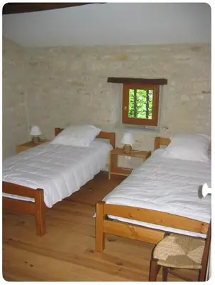 Un ou plusieurs lits dans un hébergement de l'établissement Maison SAINT AMANT DE BOIXE