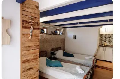 Un ou plusieurs lits dans un hébergement de l'établissement Studio cocooning entre Fouras et Rochefort