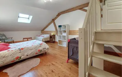 Un ou plusieurs lits dans un hébergement de l'établissement Charmante Maison À La Campagne