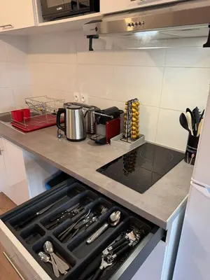 Cuisine ou kitchenette dans l'établissement Logement 11 parking gratuit