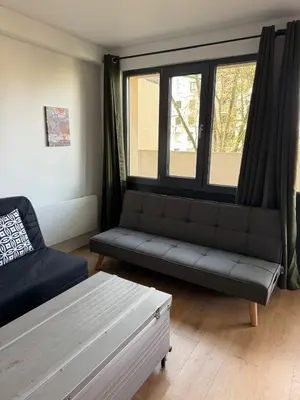 Coin salon dans l'établissement Logement 11 parking gratuit