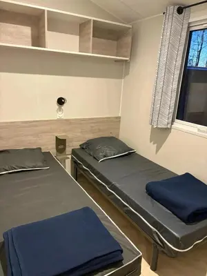 Un ou plusieurs lits dans un hébergement de l'établissement Camping 3 étoiles - Piscine - ccbfa0c