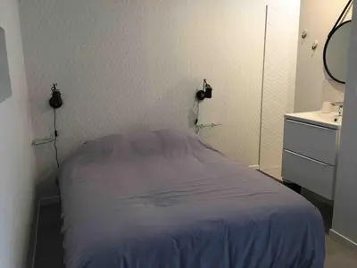 Un ou plusieurs lits dans un hébergement de l'établissement Le logis de Niort appart hôtel bis