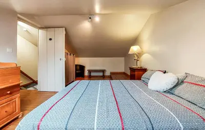 Un ou plusieurs lits dans un hébergement de l'établissement Charmante Maison Au Calme