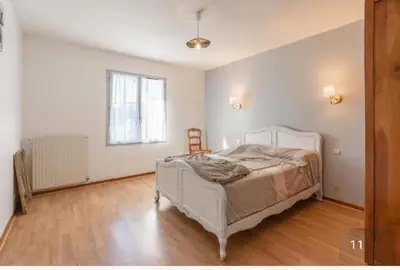 Un ou plusieurs lits dans un hébergement de l'établissement Maison au calme avec jardin cloturé