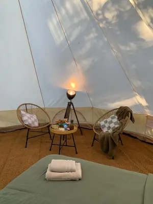 Un ou plusieurs lits dans un hébergement de l'établissement Glamping Moulin de Saza