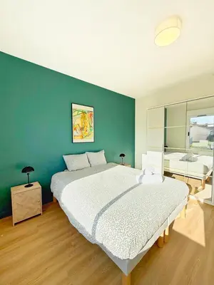 Un ou plusieurs lits dans un hébergement de l'établissement Maison Magnolia Jardin & terrasse proche centre