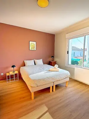 Un ou plusieurs lits dans un hébergement de l'établissement Maison Magnolia Jardin & terrasse proche centre