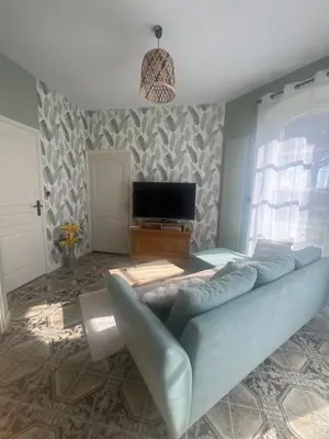Télévision ou salle de divertissement dans l'établissement Maison en pierre