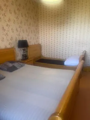 Un ou plusieurs lits dans un hébergement de l'établissement Maison en pierre