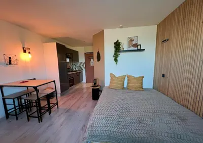 Un ou plusieurs lits dans un hébergement de l'établissement Studio 127 à 8 min à pied du Futuroscope 1 à 4 pers