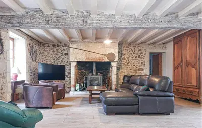 Coin salon dans l'établissement Charmante Maison Au Calme