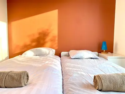 Un ou plusieurs lits dans un hébergement de l'établissement La Maison des Oiseaux