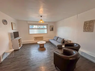 Coin salon dans l'établissement Appartement Neuf 4P - Terrasse - Parking