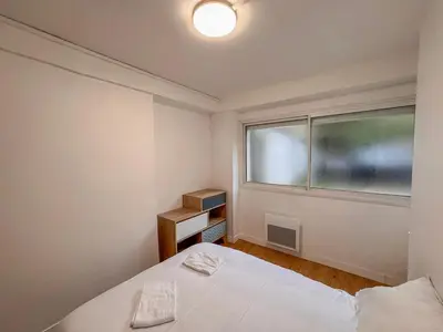 Un ou plusieurs lits dans un hébergement de l'établissement Studio Neuf Centre - Chambre Séparée - Parking