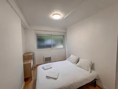 Un ou plusieurs lits dans un hébergement de l'établissement Studio Neuf Centre - Chambre Séparée - Parking