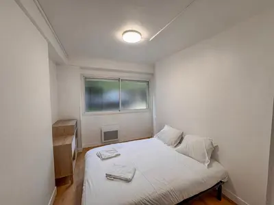 Un ou plusieurs lits dans un hébergement de l'établissement Studio Neuf Centre - Chambre Séparée - Parking