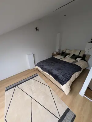 Un ou plusieurs lits dans un hébergement de l'établissement Townhouse in Poitiers Center