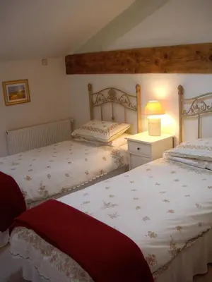 Un ou plusieurs lits dans un hébergement de l'établissement Maison Du Ruisseau