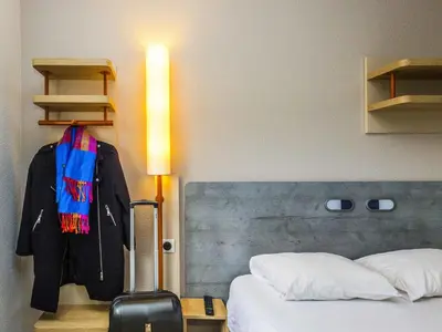 Un ou plusieurs lits dans un hébergement de l'établissement ibis budget Rochefort