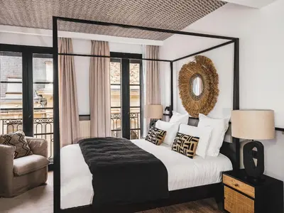 Un ou plusieurs lits dans un hébergement de l'établissement Maisons du Monde Hôtel & Suites - La Rochelle Vieux Port